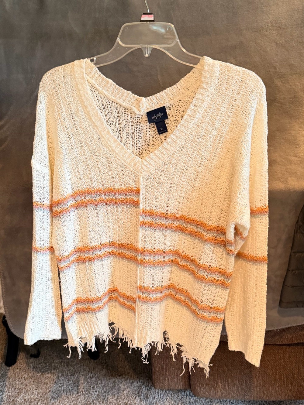 Cream V-Neck Sweater with Orange & Pink Stripes